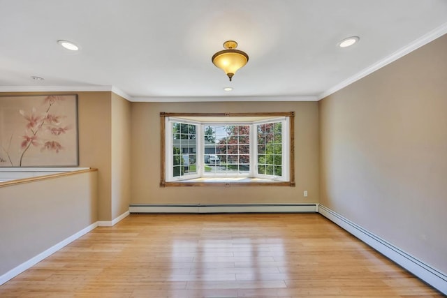 25 Terrace View Rd, Farmingdale, NY 11735 - spare room featuring a baseboard radiator, wood finished floors, ornamental molding, baseboards, and recessed lighting