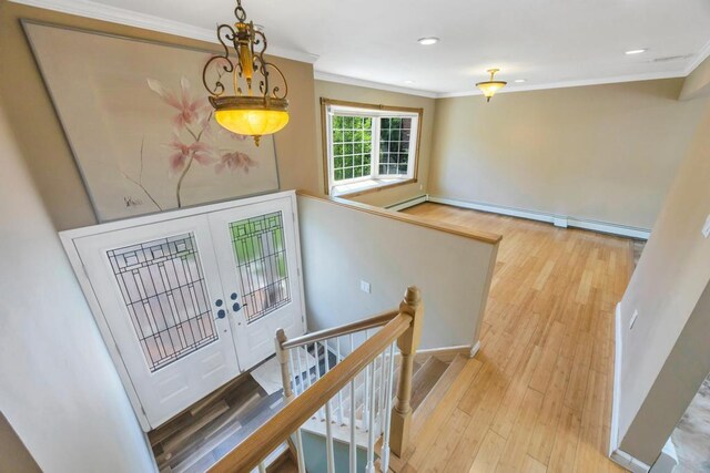 25 Terrace View Rd, Farmingdale, NY 11735 - entryway with ornamental molding, a baseboard radiator, wood finished floors, recessed lighting, and baseboards