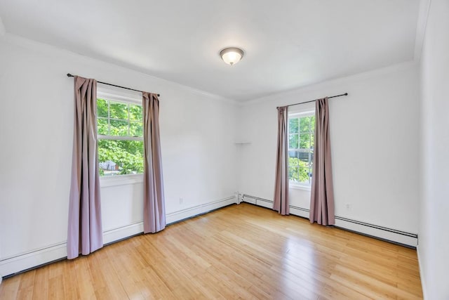 25 Terrace View Rd, Farmingdale, NY 11735 - spare room featuring plenty of natural light, wood finished floors, crown molding, and baseboard heating