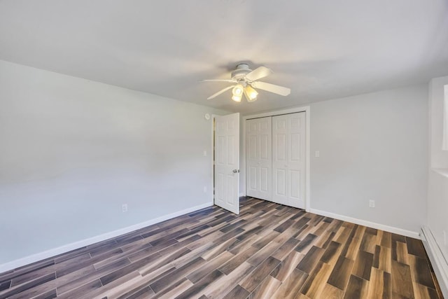 25 Terrace View Rd, Farmingdale, NY 11735 - unfurnished bedroom featuring a baseboard heating unit, wood finished floors, baseboards, a closet, and a ceiling fan