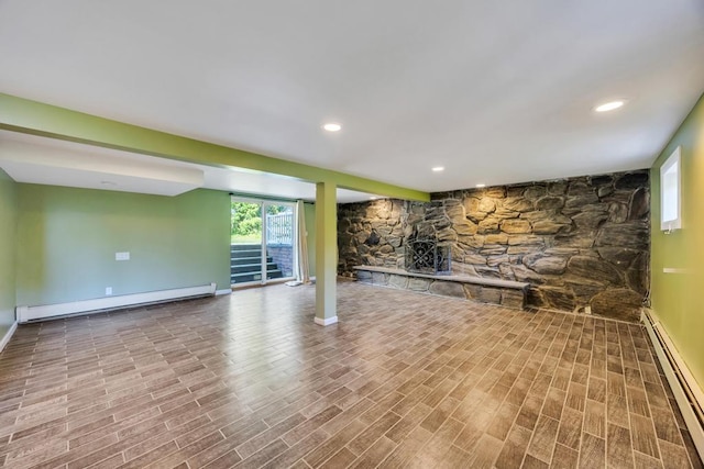 25 Terrace View Rd, Farmingdale, NY 11735 - below grade area with baseboard heating, wood finished floors, and baseboards