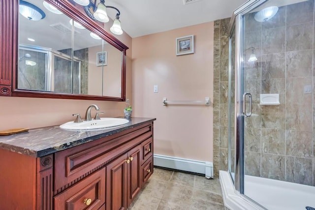 25 Terrace View Rd, Farmingdale, NY 11735 - bathroom featuring a baseboard heating unit, a stall shower, vanity, and tile patterned flooring
