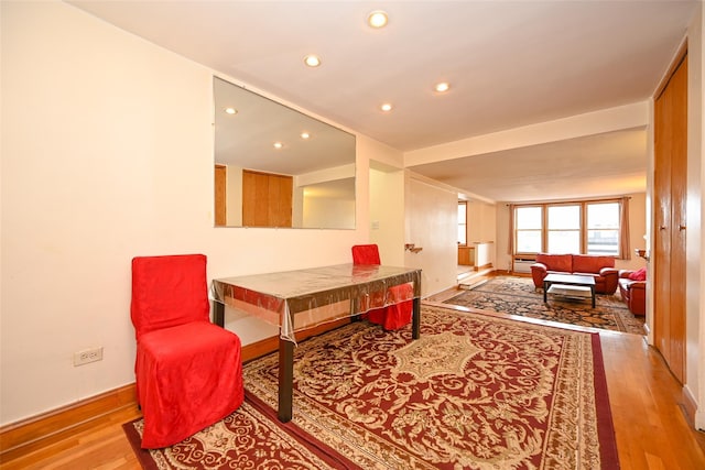 sitting room with recessed lighting, wood finished floors, and baseboards