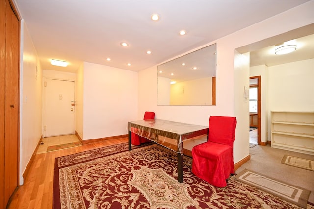 sitting room featuring recessed lighting, baseboards, and light wood finished floors