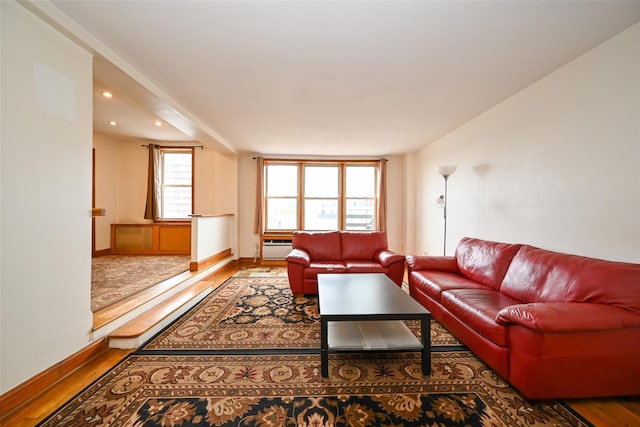 living area with wood finished floors, baseboards, and recessed lighting