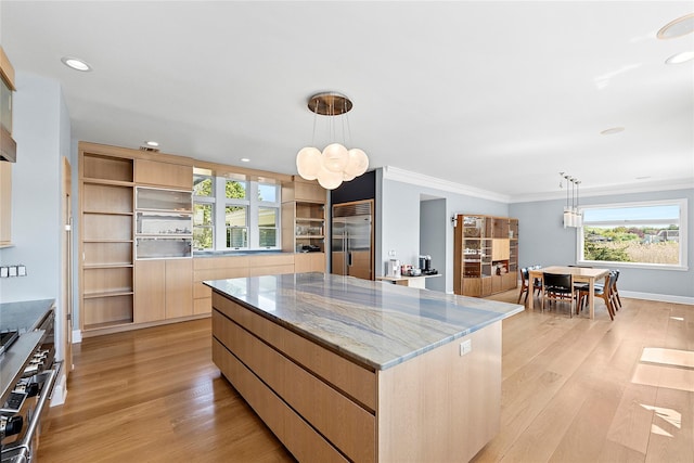 14 S Country Rd, Westhampton, NY 11977 - kitchen with high quality appliances, a kitchen island, a chandelier, modern cabinets, and light wood-style floors