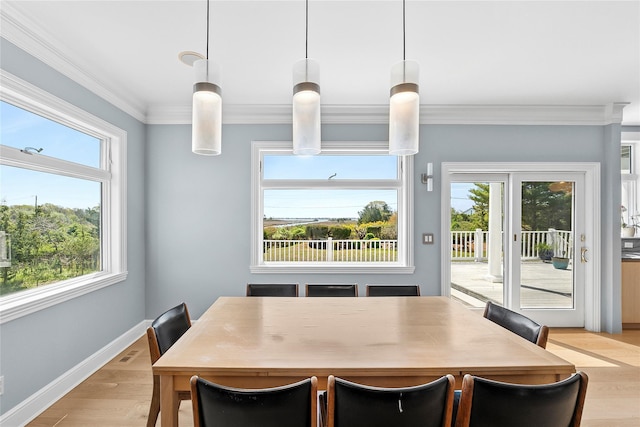 14 S Country Rd, Westhampton, NY 11977 - dining area with plenty of natural light, ornamental molding, and light wood-type flooring