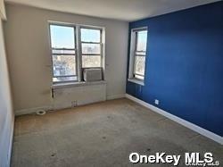 102-21 63rd Rd Unit 47A, Forest Hills, NY 11375 - unfurnished room featuring baseboards and carpet floors