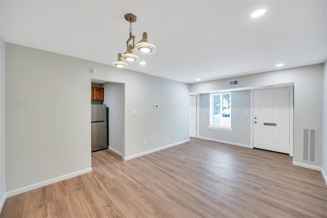 9 Sierra Ct Unit 0, Coram, NY 11727 - spare room featuring light wood finished floors, baseboards, and recessed lighting