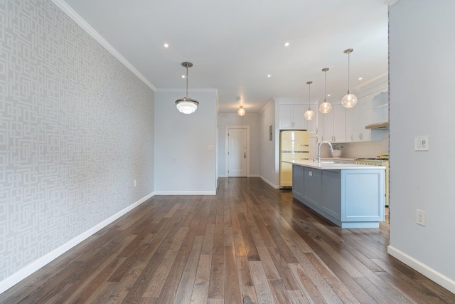 89-10 35th Ave Unit F2L, Jackson Heights, NY 11372 - kitchen featuring freestanding refrigerator, light countertops, baseboards, wallpapered walls, and crown molding