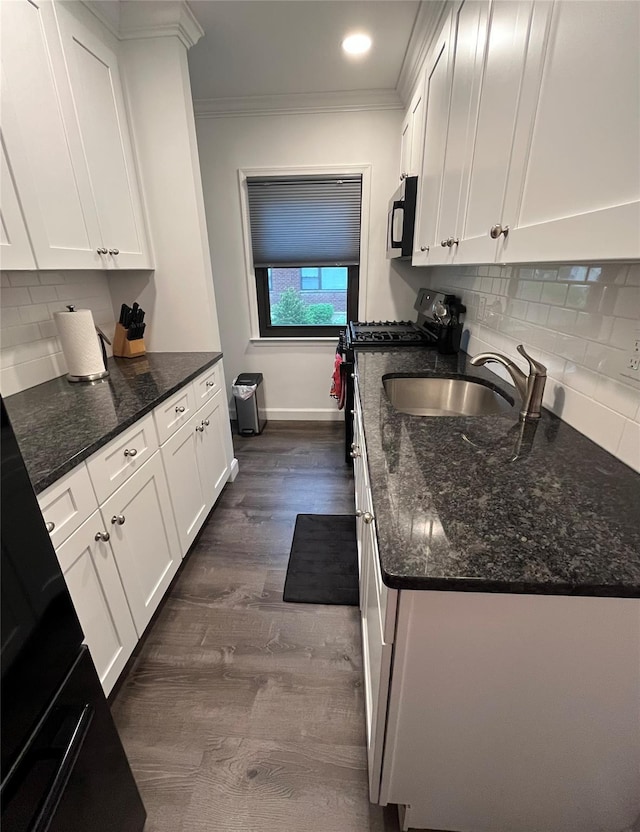 5 Adelaide St Unit B2, A1, Floral Park, NY 11001 - kitchen featuring black microwave, ornamental molding, white cabinets, a sink, and gas range oven