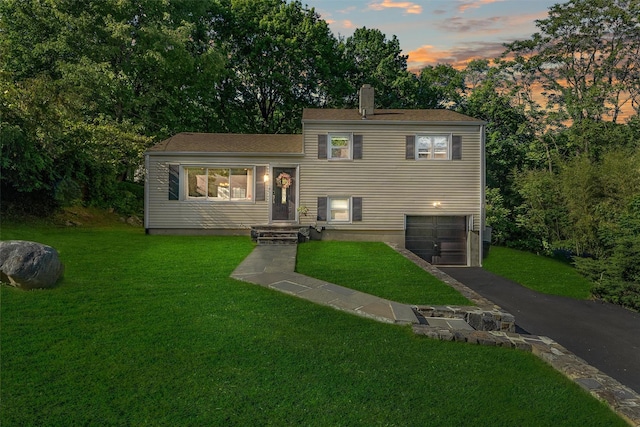 10 Ridge Rd, Cortlandt Manor, NY 10567 - tri-level home featuring an attached garage, driveway, and a yard
