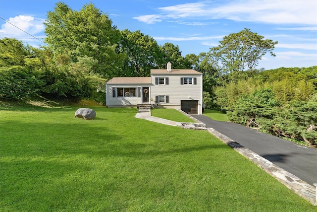 10 Ridge Rd, Cortlandt Manor, NY 10567 - tri-level home with asphalt driveway, a garage, a front yard, and a chimney