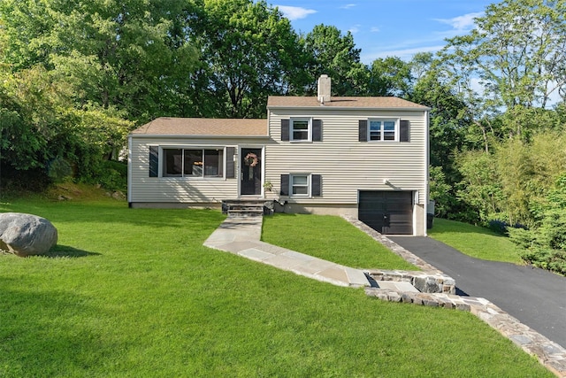10 Ridge Rd, Cortlandt Manor, NY 10567 - split level home featuring an attached garage, driveway, and a front lawn