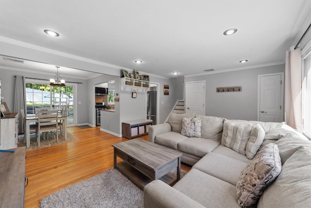 10 Ridge Rd, Cortlandt Manor, NY 10567 - living area with recessed lighting, ornamental molding, light wood-style floors, stairway, and a chandelier
