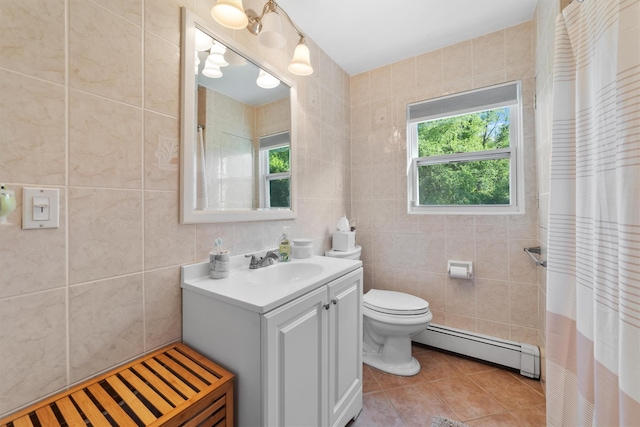 10 Ridge Rd, Cortlandt Manor, NY 10567 - full bath featuring baseboard heating, tile walls, vanity, tile patterned flooring, and toilet