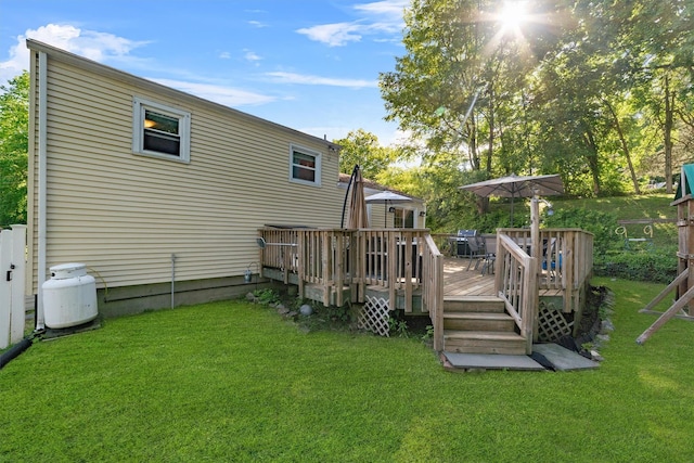 10 Ridge Rd, Cortlandt Manor, NY 10567 - rear view of property featuring a lawn and a deck