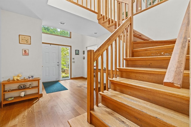 1260 Albany Post Rd, Croton-On-Hudson, NY 10520 - foyer entrance featuring stairs, hardwood / wood-style floors, and a high ceiling