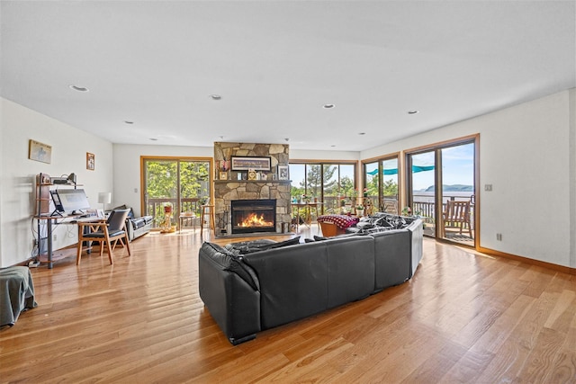 1260 Albany Post Rd, Croton-On-Hudson, NY 10520 - living area featuring light wood finished floors, a stone fireplace, and recessed lighting