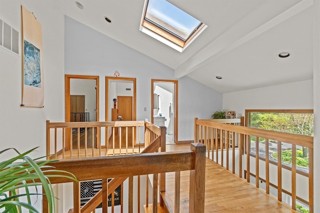 1260 Albany Post Rd, Croton-On-Hudson, NY 10520 - hallway with an upstairs landing, light wood-style flooring, a skylight, and recessed lighting