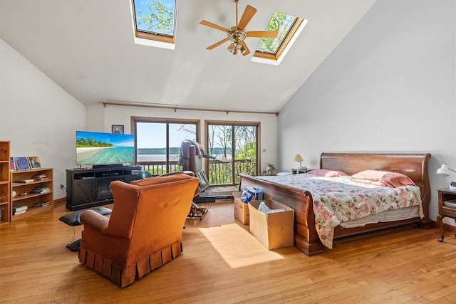 1260 Albany Post Rd, Croton-On-Hudson, NY 10520 - bedroom with a skylight, access to exterior, hardwood / wood-style floors, high vaulted ceiling, and ceiling fan