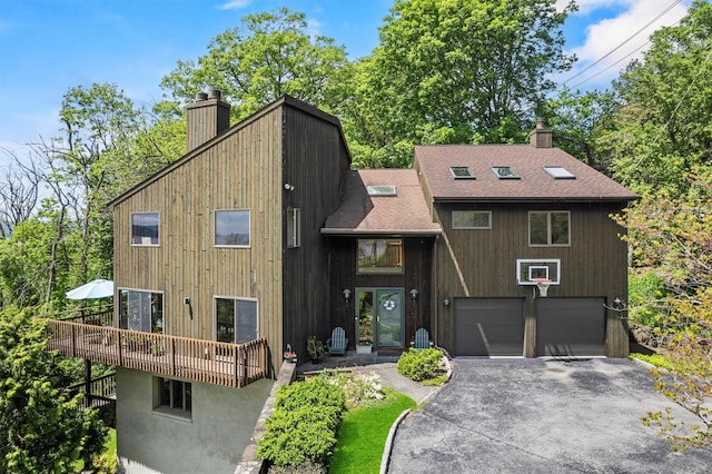 1260 Albany Post Rd, Croton-On-Hudson, NY 10520 - view of front facade featuring a chimney, driveway, a shingled roof, and an attached garage