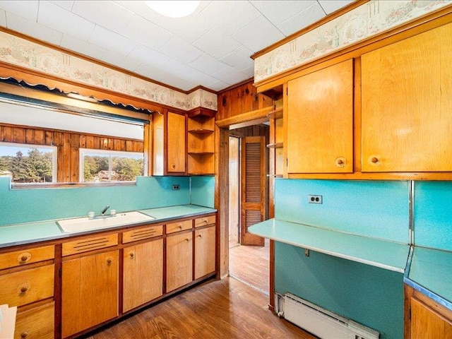 58 Hathorn Blvd, Port Jervis, NY 12771 - kitchen with a sink, open shelves, a baseboard radiator, light countertops, and crown molding
