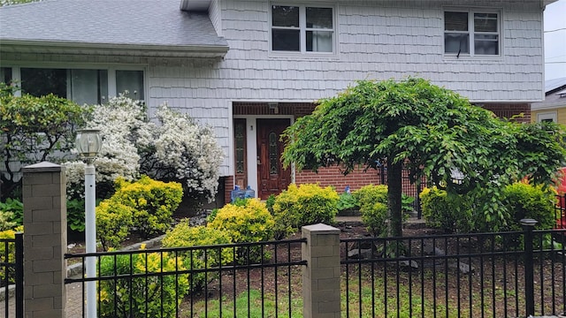 1 Cheshire Ln, Yonkers, NY 10710 - property entrance featuring roof with shingles
