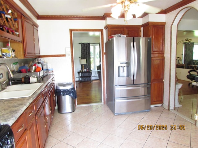 1 Cheshire Ln, Yonkers, NY 10710 - kitchen with stainless steel refrigerator with ice dispenser, ceiling fan, arched walkways, ornamental molding, and light tile patterned floors