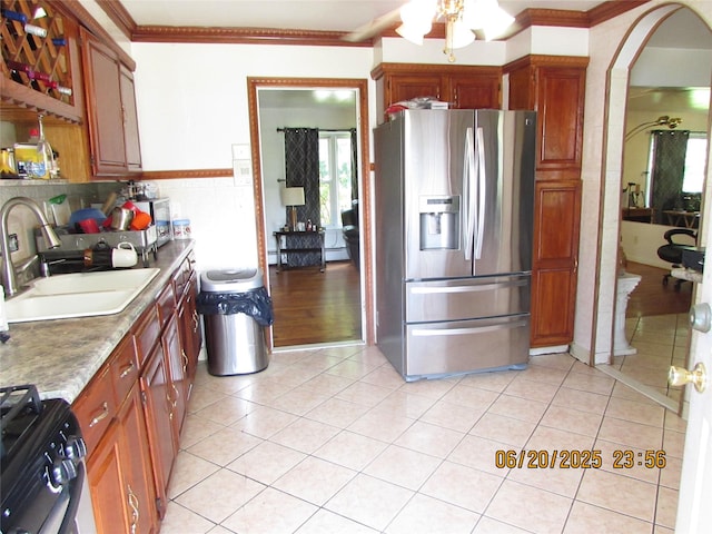 1 Cheshire Ln, Yonkers, NY 10710 - kitchen featuring stainless steel refrigerator with ice dispenser, range, light tile patterned floors, ornamental molding, and ceiling fan