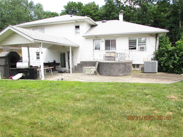 1 Cheshire Ln, Yonkers, NY 10710 - rear view of house featuring a patio, a yard, a chimney, and a shingled roof