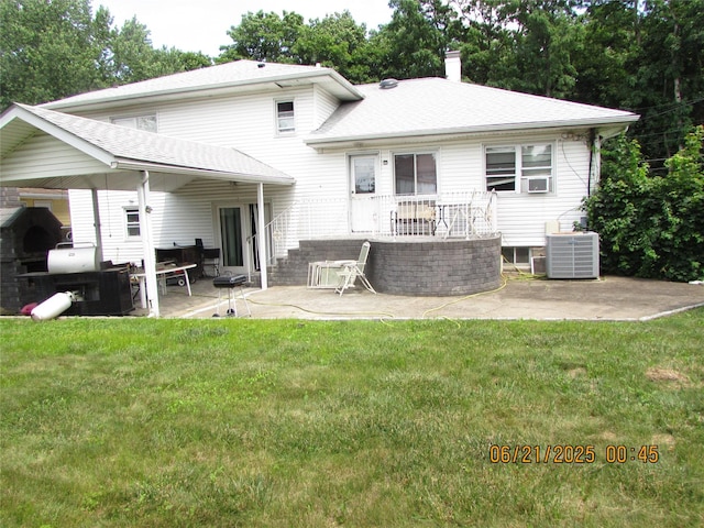 1 Cheshire Ln, Yonkers, NY 10710 - rear view of property featuring a patio, a yard, a chimney, and a shingled roof