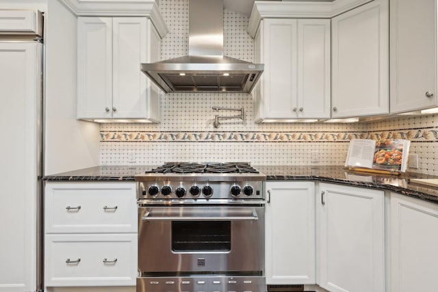56 Rolling Way, New Rochelle, NY 10804 - kitchen featuring stainless steel stove, wall chimney exhaust hood, tasteful backsplash, and dark stone counters