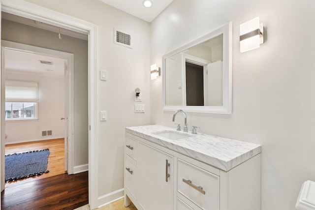 56 Rolling Way, New Rochelle, NY 10804 - bathroom with wood finished floors, vanity, and baseboards