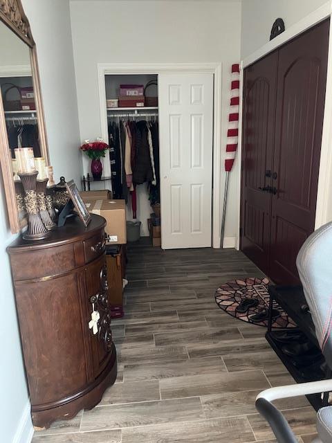 foyer featuring wood finished floors