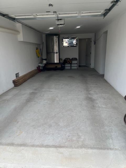 garage with freestanding refrigerator