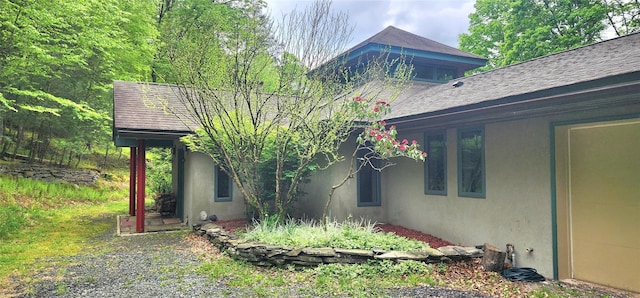view of side of home featuring stucco siding