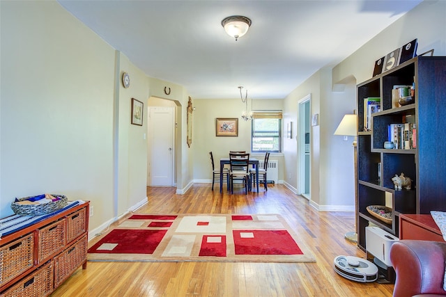 218-10 43rd Ave Unit 3D, Bayside, NY 11361 - dining area with wood finished floors, arched walkways, and radiator