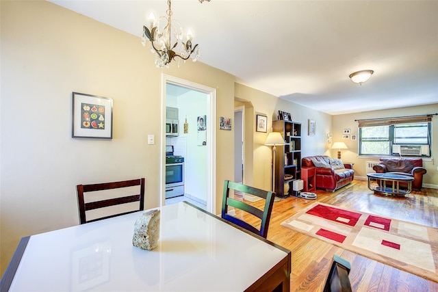 218-10 43rd Ave Unit 3D, Bayside, NY 11361 - dining room with a chandelier, wood finished floors, and cooling unit