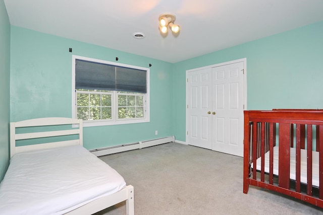 67 N Airmont Rd, Suffern, NY 10901 - carpeted bedroom featuring baseboard heating, a closet, and baseboards