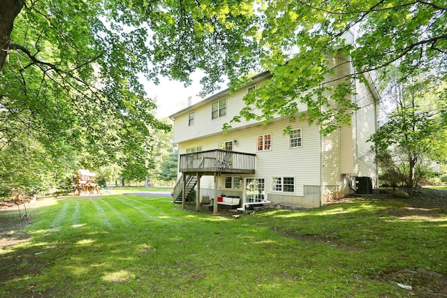 67 N Airmont Rd, Suffern, NY 10901 - rear view of property with stairs, a yard, a wooden deck, a chimney, and cooling unit