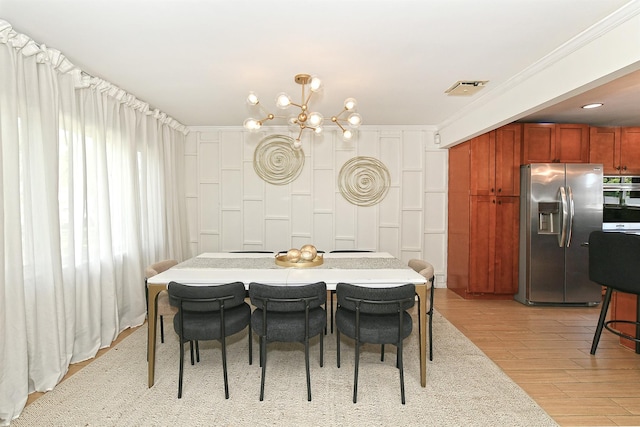 45 Longworth Ave, Dix Hills, NY 11746 - dining space featuring a chandelier, crown molding, and light wood-style flooring