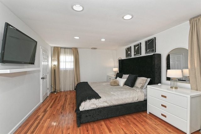 45 Longworth Ave, Dix Hills, NY 11746 - bedroom featuring light wood-type flooring and recessed lighting