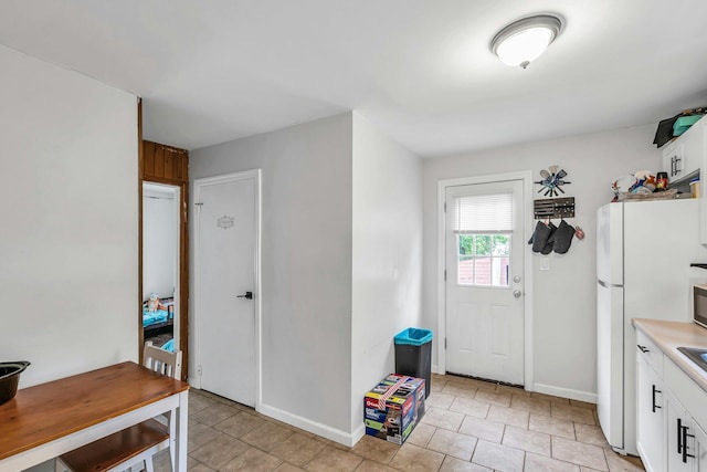 17 Lexington Rd, Shirley, NY 11967 - foyer entrance featuring baseboards and light tile patterned floors
