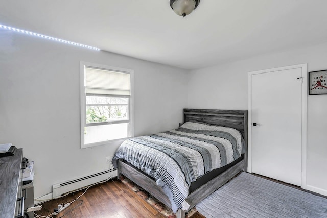 17 Lexington Rd, Shirley, NY 11967 - bedroom with baseboard heating and wood finished floors