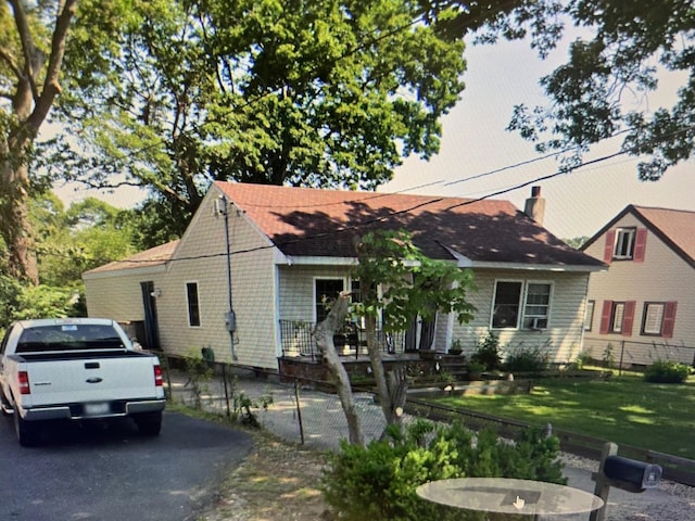 view of front of house with roof with shingles