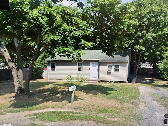 view of front facade featuring entry steps and a shingled roof