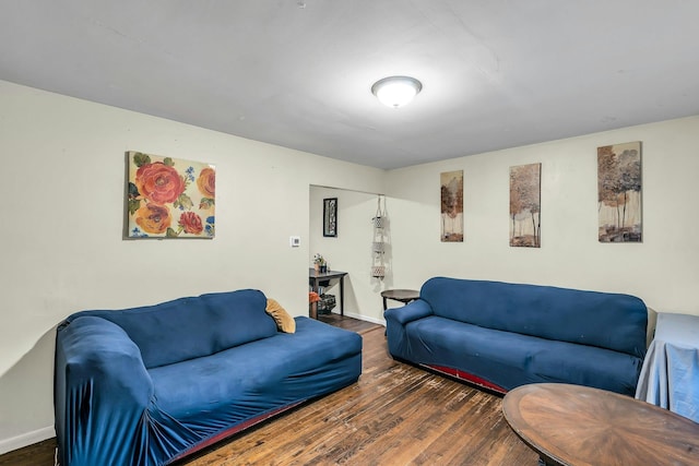 625 Scherger Ave, East Patchogue, NY 11772 - living room featuring wood finished floors and baseboards