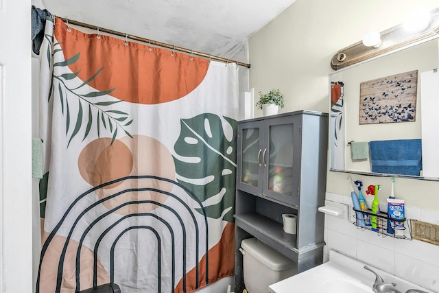 625 Scherger Ave, East Patchogue, NY 11772 - bathroom featuring toilet, a shower with shower curtain, and a sink