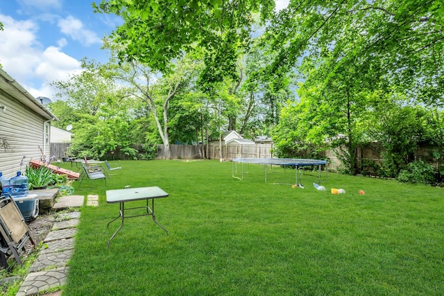 625 Scherger Ave, East Patchogue, NY 11772 - view of yard with a trampoline